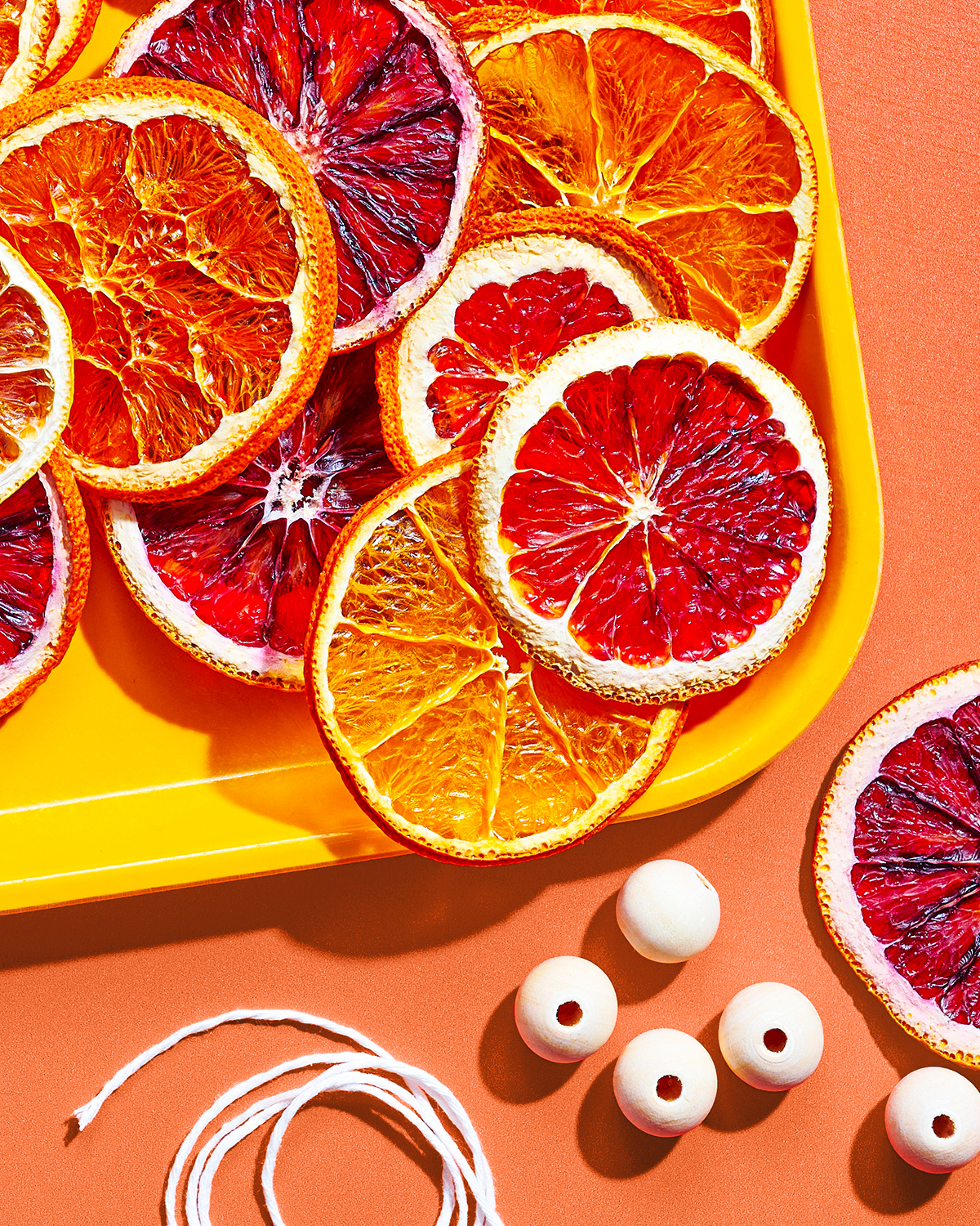 A tray of dried Peelz citrus for a DIY citrus garland