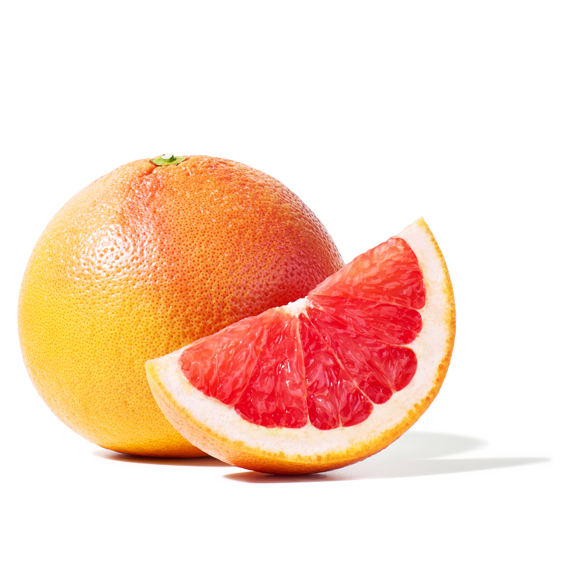 A whole Peelz grapefruit with a grapefruit wedge