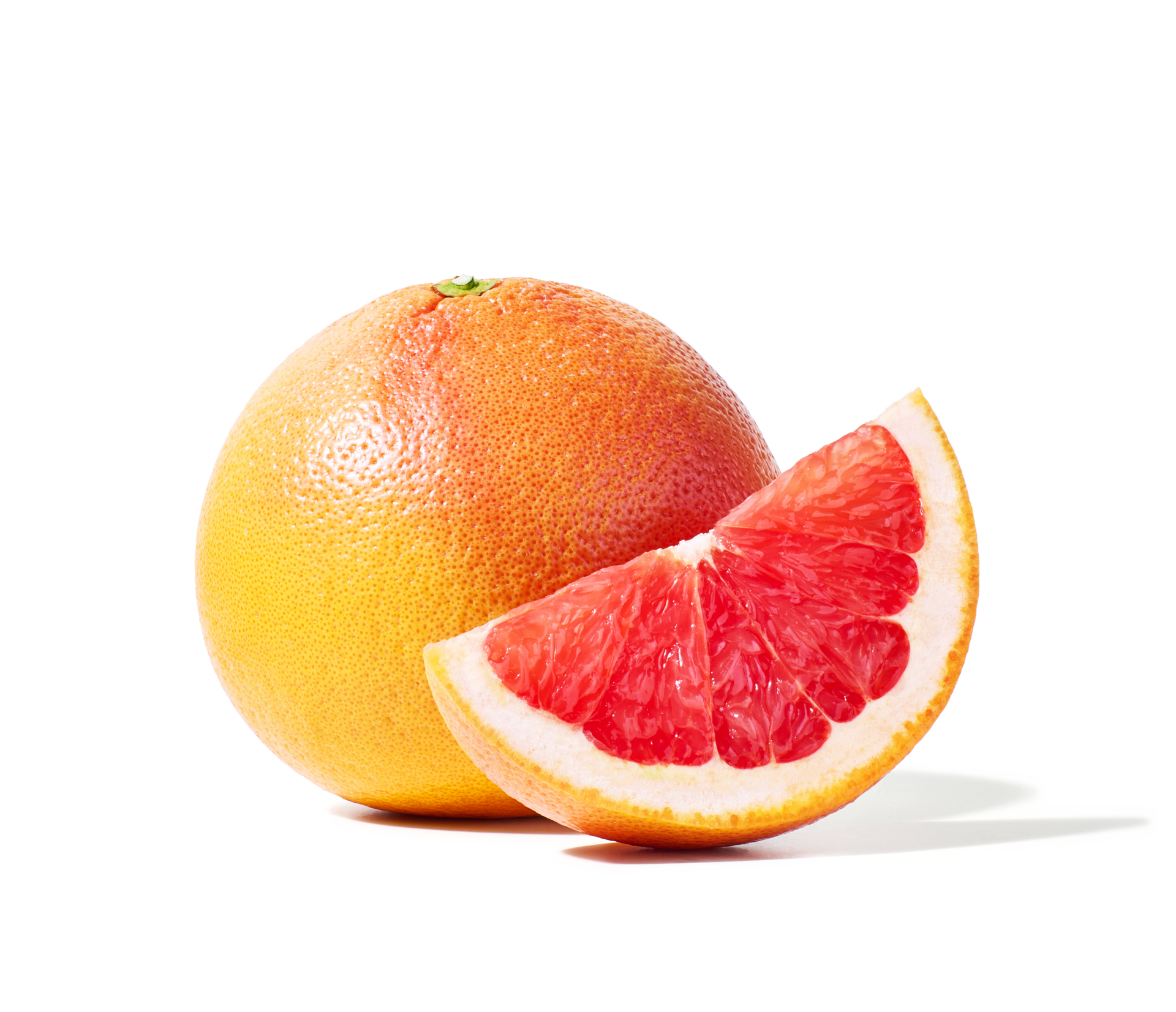 A whole Peelz grapefruit with a grapefruit wedge